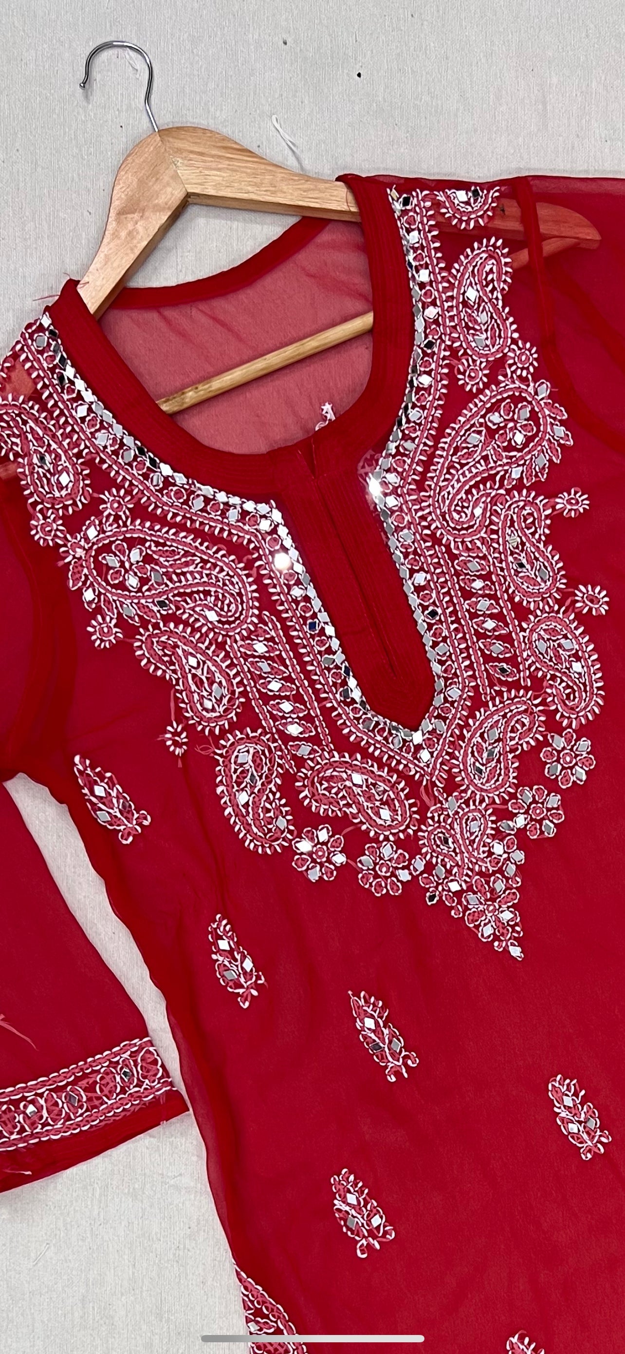 A-top bottom-view-Red handmade chikankari kurti with intricate mirror work, traditional embroidery, and elegant ethnic design for women.