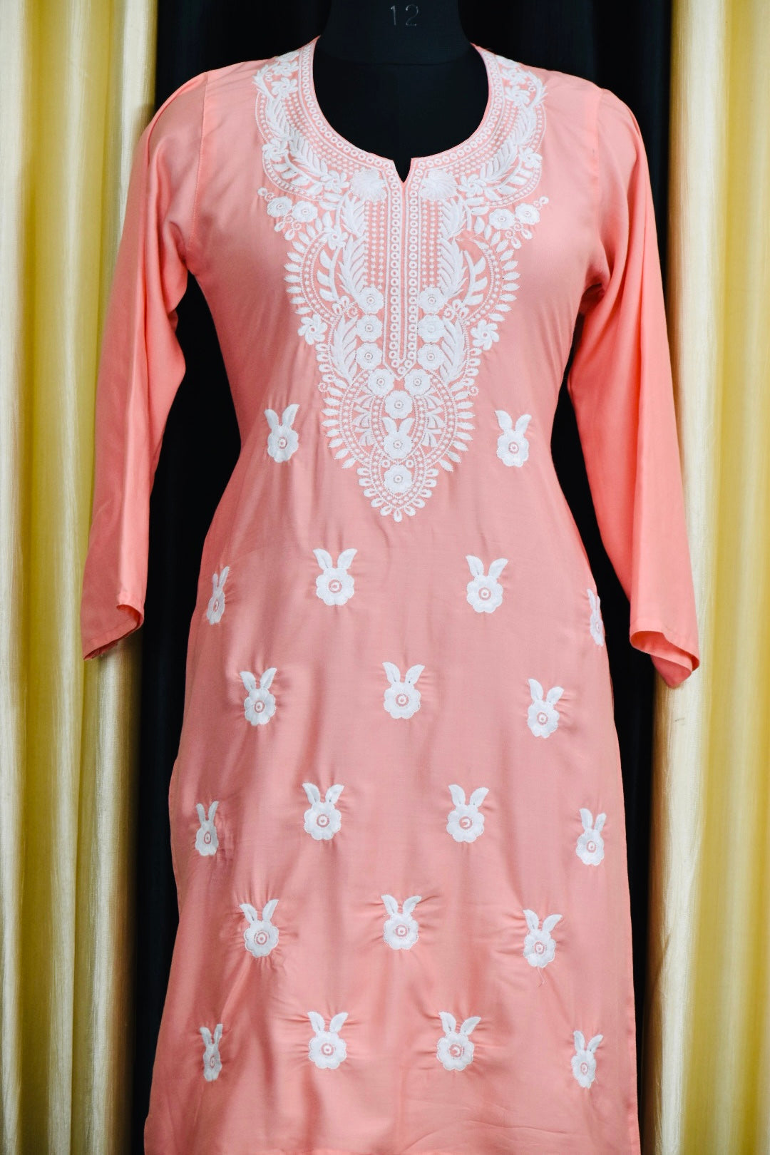 A-front-view-Beautiful peach Cotton Chikankari Fabric Featuring Traditional Hand-Embroidered Designs."
Let me know if you'd like more variations