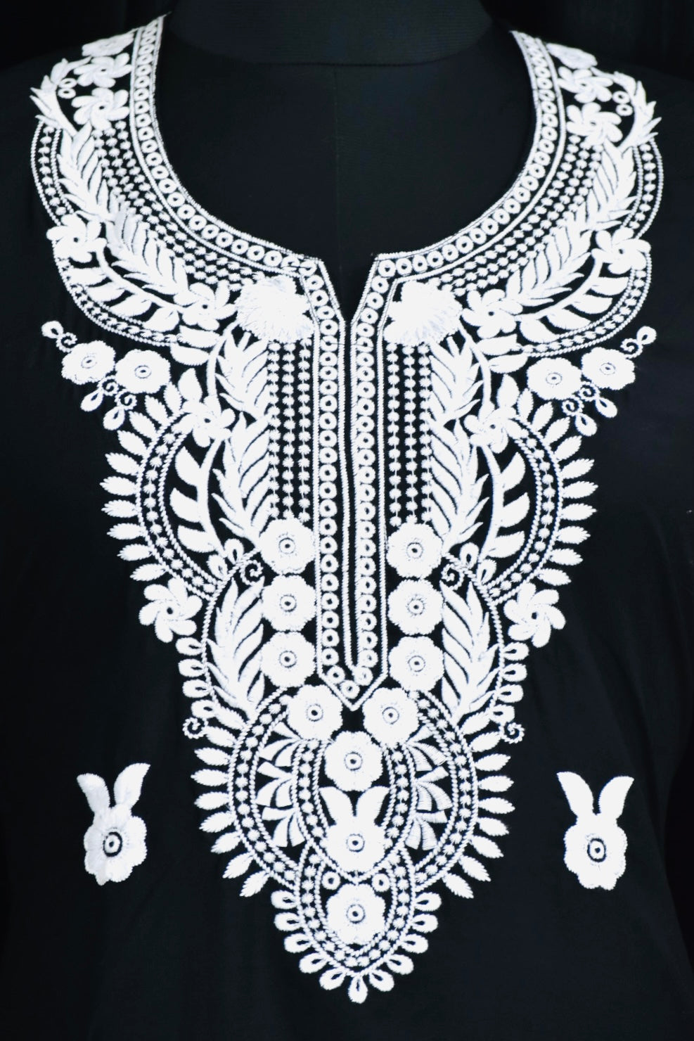 A-bottom-view-Vibrant Navi blue cotton kurti featuring intricate Chikankari embroidery, showcasing delicate floral patterns that add a traditional touch to a modern silhouette.